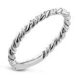 This ring is a twist on a halo engagement ring, with 18k yellow and white gold intertwining in the band.