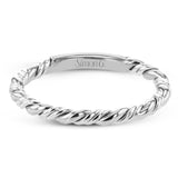 This ring is a twist on a halo engagement ring, with 18k yellow and white gold intertwining in the band.