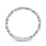 This ring is a twist on a halo engagement ring, with 18k yellow and white gold intertwining in the band.
