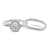 This ring is a twist on a halo engagement ring, with 18k yellow and white gold intertwining in the band.