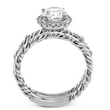 This ring is a twist on a halo engagement ring, with 18k yellow and white gold intertwining in the band.