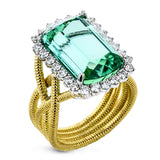 18k right hand ring has a twisted yelow gold coil shank, and features a stunning an emerald cut Green Tourmaline 9.90 ctw. with a halo of white diamonds 0.77 ctw.