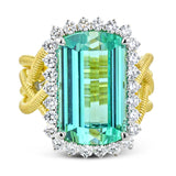 18k right hand ring has a twisted yelow gold coil shank, and features a stunning an emerald cut Green Tourmaline 9.90 ctw. with a halo of white diamonds 0.77 ctw.