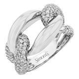 A modern two-tone right hand ring in 18K yellow and white gold, features interlocking links of high polish gold and two diamond links 1.11 ctw.