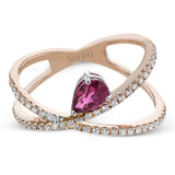 This modern 18k rose gold ring features a .61 ctw pear shaped ruby stone set against an angle, and is accented by .22 ctw of white diamonds.