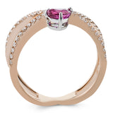 This modern 18k rose gold ring features a .61 ctw pear shaped ruby stone set against an angle, and is accented by .22 ctw of white diamonds.