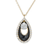Diamond, enamel, and 18k gold combine in this modern pendant to create a distinctive look.