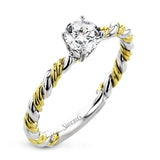 White and yellow 18k gold twine around each other in this ring that puts a twist on a classic design.