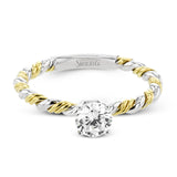 White and yellow 18k gold twine around each other in this ring that puts a twist on a classic design.