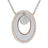 A modern circle, this 18k white and rose gold pendent features .34cttw diamonds and white enamel.