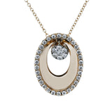 A modern circle, this 18k white and rose gold pendent features .34cttw diamonds and white enamel.