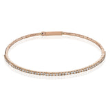 This 18K rose gold bangle bracelet featuring .76ctw diamonds is perfect for everyday wear or a night out on the town. This wardrobe staple pairs perfectly with any jewelry collection.