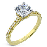 Featuring our new underhalo design, a ring of diamonds sits underneath the center stone in this bridal ring, giving a remarkable side view.