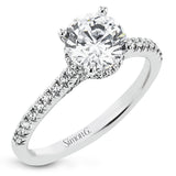 Featuring our new underhalo design, a ring of diamonds sits underneath the center stone in this bridal ring, giving a remarkable side view.