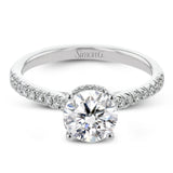 Featuring our new underhalo design, a ring of diamonds sits underneath the center stone in this bridal ring, giving a remarkable side view.