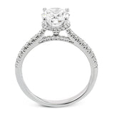 Featuring our new underhalo design, a ring of diamonds sits underneath the center stone in this bridal ring, giving a remarkable side view.