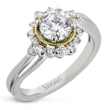 Full of interesting design details, this engagement ring from our Supernova collection features a yellow gold milgrain halo around the center stone, and an outer halo set with .20 ctw of white diamonds.
