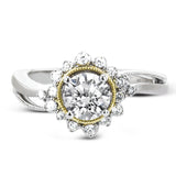 Full of interesting design details, this engagement ring from our Supernova collection features a yellow gold milgrain halo around the center stone, and an outer halo set with .20 ctw of white diamonds.