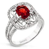 Delicate filigree adorns this vintage inspired ring, while a stunning gemstone center lends an essential dose of color.