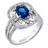 Delicate filigree adorns this vintage inspired ring, while a stunning gemstone center lends an essential dose of color.