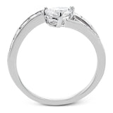 Like lightning zig-zagging across the sky, this dynamic 18k white gold ring contains a flowing line of .62 ctw baguette diamonds and one .55 ct pear shaped diamond set at an angle.