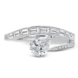 Like lightning zig-zagging across the sky, this dynamic 18k white gold ring contains a flowing line of .62 ctw baguette diamonds and one .55 ct pear shaped diamond set at an angle.