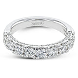 This straight band is anything but ordinary, containing an impressive 1.44 ctw of white diamonds.