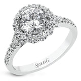 This lovely engagement ring provides an impressive amount of sparkle with .73 ctw in a halo design.