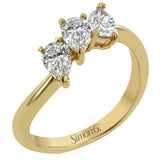 This ring provides a distinctive take on a three stone ring that can be worn on an every day basis, with three pear shaped diamonds totaling .91 ctw nestled together.