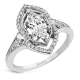 This intricate and unique ring setting is made for a marquise shaped center stone and features .23 ctw of white accent diamonds in 18k white and rose gold.