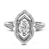 This intricate and unique ring setting is made for a marquise shaped center stone and features .23 ctw of white accent diamonds in 18k white and rose gold.