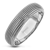 This 14k gold band features a granulated surface that is hand-created by experienced artisans.