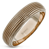 This 14k gold band features a granulated surface that is hand-created by experienced artisans.