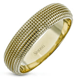 This 14k gold band features a granulated surface that is hand-created by experienced artisans.