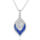 This unique pendant contains a section of custom cut blue sapphires that fit together perfectly, as well as a mosaic of diamonds.