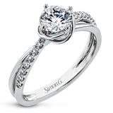 This criss-cross design engagement ring shimmers with 0.15 ctw round diamonds and a halo of gold strands wrapped around the center