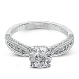 Delightful details abound in this 18k white gold engagement ring, set with .33 ctw of side diamonds.