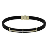 This bold bracelet features black rubber with 14k gold accents set with .35 ctw of white diamonds.