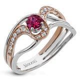 This exceptional two-toned 18k gold design features an organic undulating design set with a .42 ct ruby and .17 ctw of white diamonds.