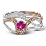 This exceptional two-toned 18k gold design features an organic undulating design set with a .42 ct ruby and .17 ctw of white diamonds.