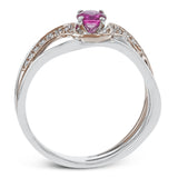 This exceptional two-toned 18k gold design features an organic undulating design set with a .42 ct ruby and .17 ctw of white diamonds.