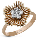 This unique two tone ring features polished gold wires evoking a starbust design, and has a center cluster of diamonds 0.23 ctw.