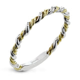 This ring is certainly a twist on a classic, with the band and halo formed from two tones of 18k gold twisted together, and the engagement ring set with .18 ctw of diamonds.