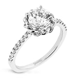 This ring is certainly a twist on a classic, with the band and halo formed from two tones of 18k gold twisted together, and the engagement ring set with .18 ctw of diamonds.