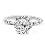 This ring is certainly a twist on a classic, with the band and halo formed from two tones of 18k gold twisted together, and the engagement ring set with .18 ctw of diamonds.