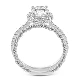 This ring is certainly a twist on a classic, with the band and halo formed from two tones of 18k gold twisted together, and the engagement ring set with .18 ctw of diamonds.
