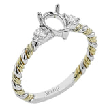 Wrap this ring around your finger for a distinctive style statement sure to stand the test of time- yellow and white 18k gold twisted together with .24 ctw of white diamond side stones.