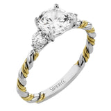 Wrap this ring around your finger for a distinctive style statement sure to stand the test of time- yellow and white 18k gold twisted together with .24 ctw of white diamond side stones.