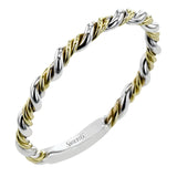 Wrap this ring around your finger for a distinctive style statement sure to stand the test of time- yellow and white 18k gold twisted together with .24 ctw of white diamond side stones.