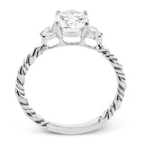 Wrap this ring around your finger for a distinctive style statement sure to stand the test of time- yellow and white 18k gold twisted together with .24 ctw of white diamond side stones.